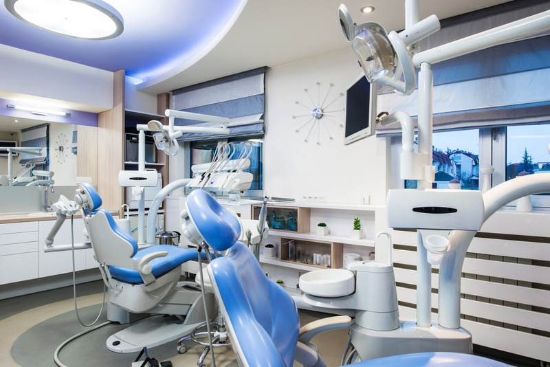Canva - dental office interior design with chair and tools